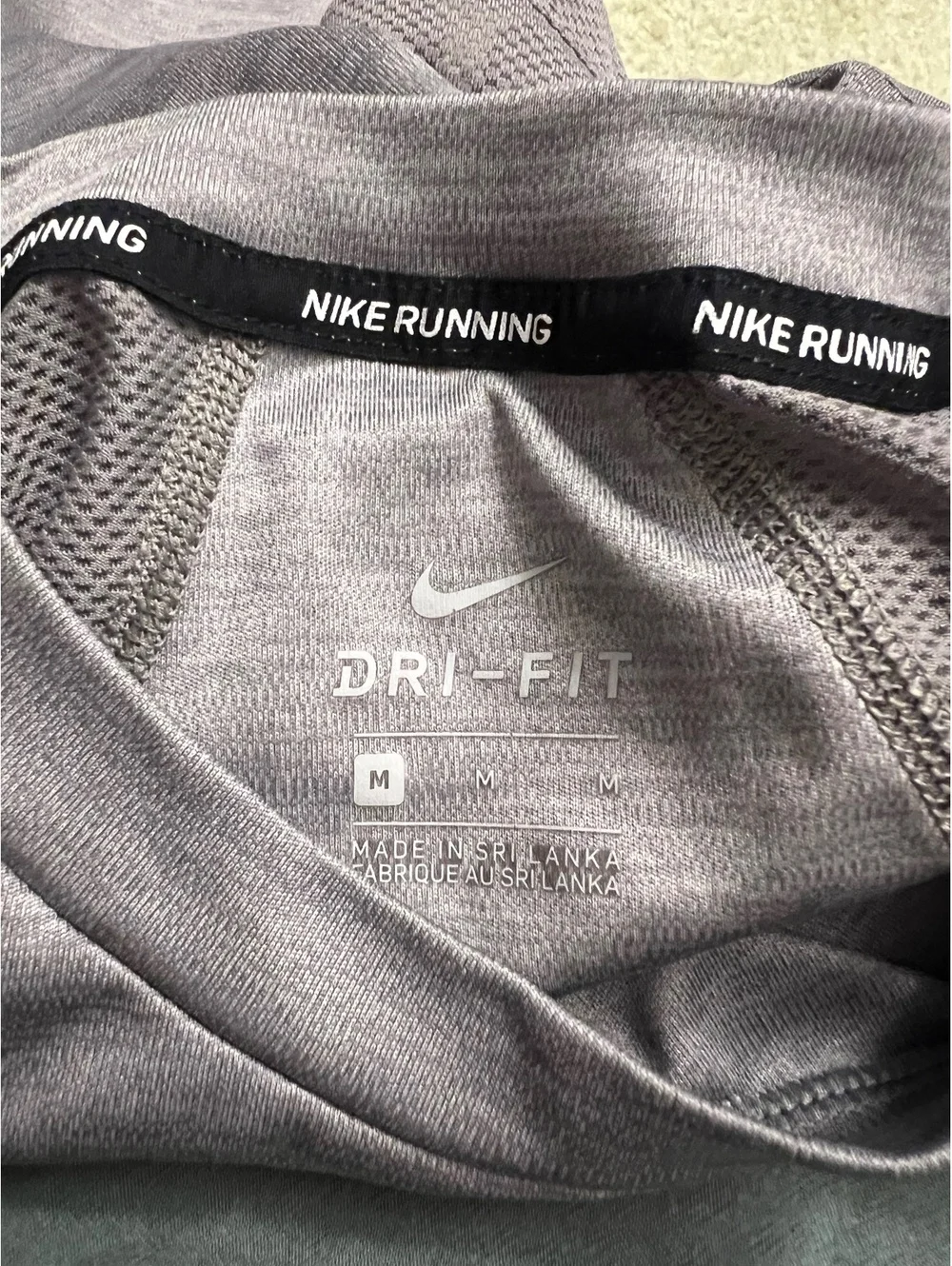 Nike women’s gray workout top medium (flaw)
